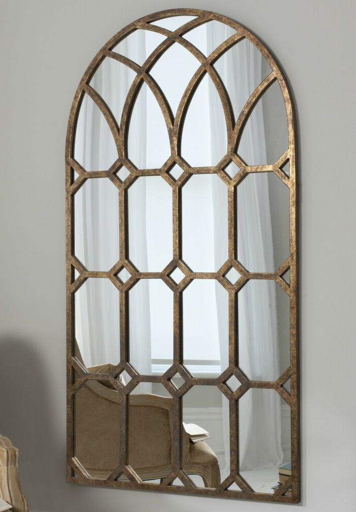 Most Current Khadra Extra Large Vintage Aged Bronze Metal Arched Window Wall Mirror Within Bronze Arch Top Wall Mirrors (View 1 of 15)